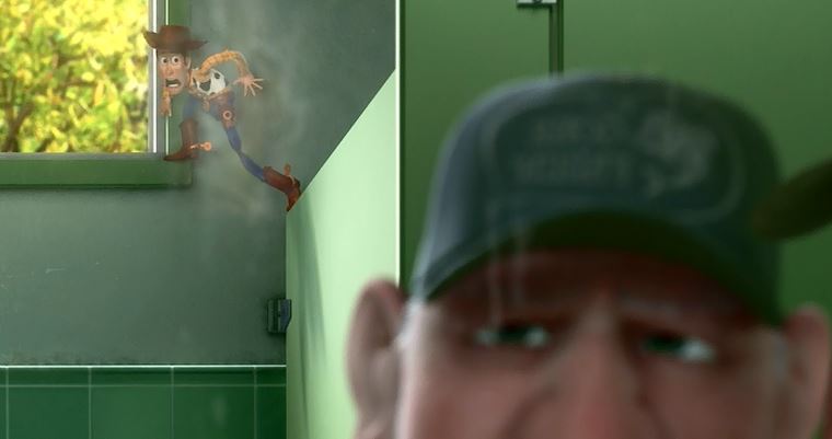 "What the..? Is that a toy ledged there between the bathroom stall and the window?"